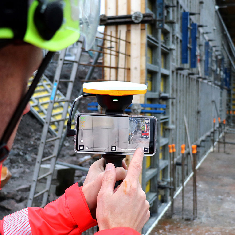 Handheld Trimble Site Vision / use of augmented reality on construction site. Photo.